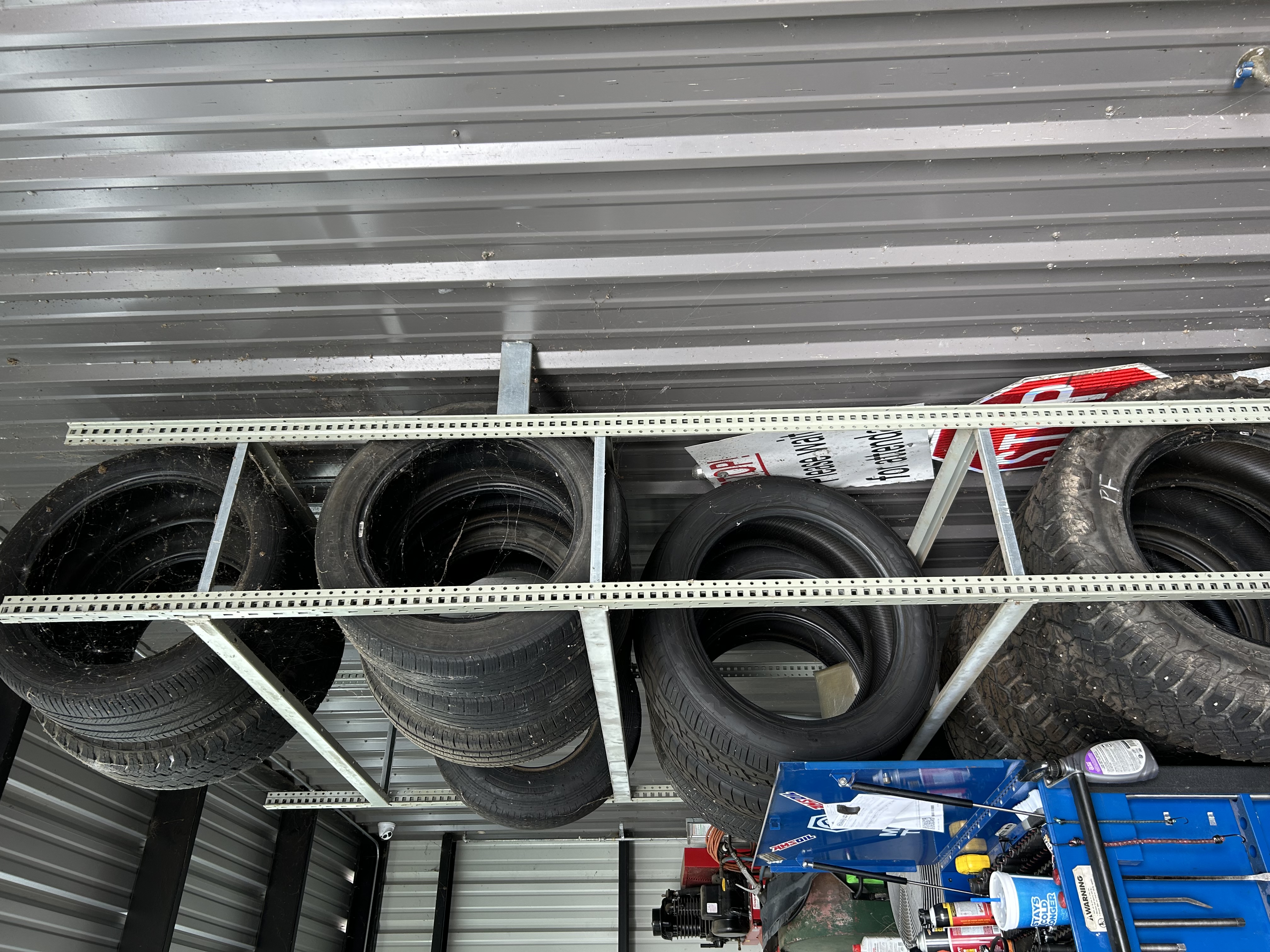 Tire inventory stocked on shelving at Thomas' Mustang Lube & Auto Repair in Kingsland, TX