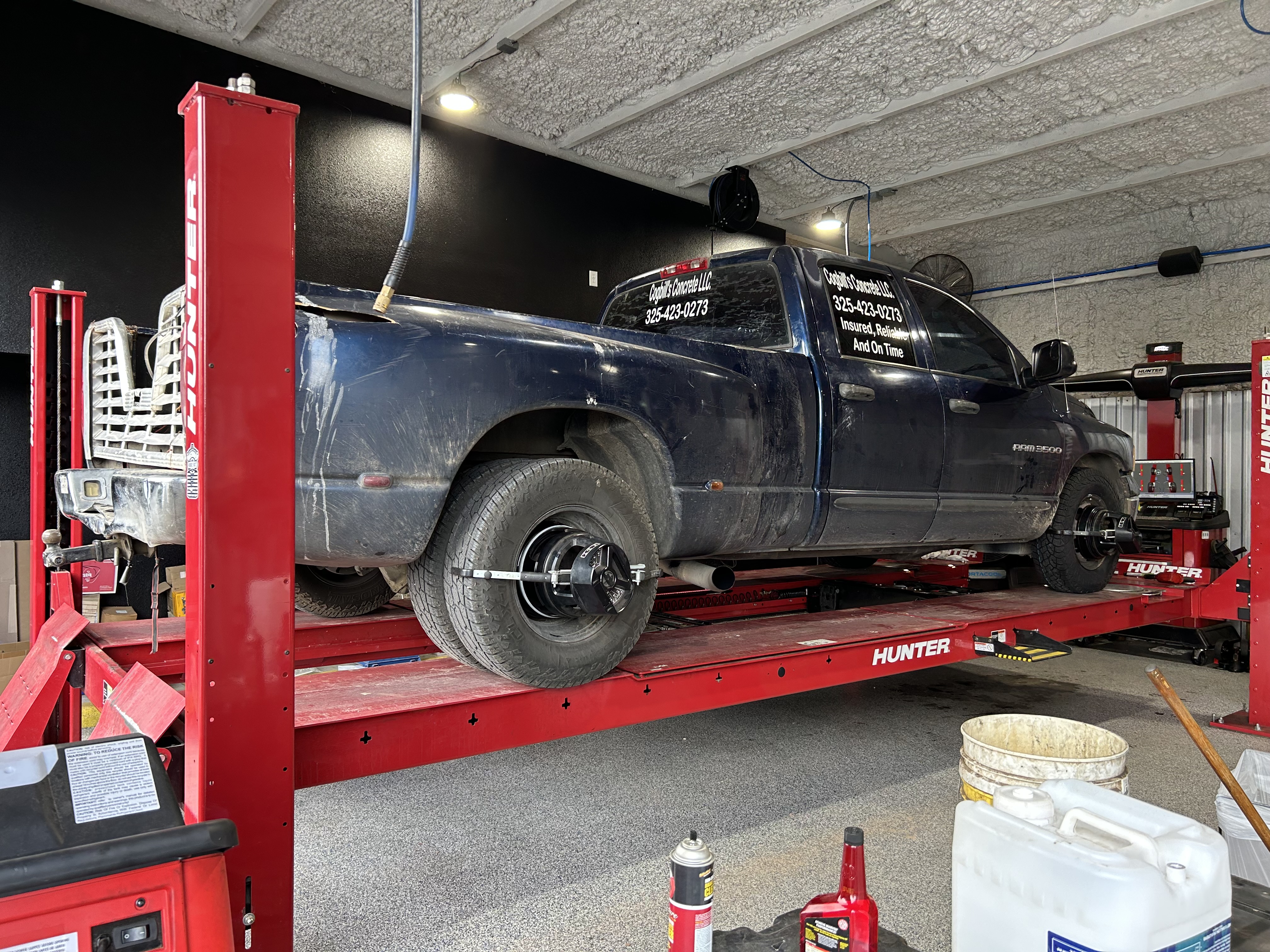 Dodge Ram dually on a Hunter computerized alignment lift at Thomas' Mustang Lube & Auto Repair in Kingsland, TX